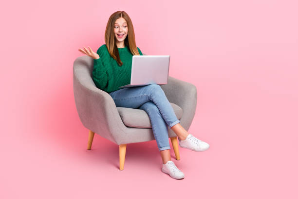 istock Full length photo of pretty impressed girl dressed knitted pullover reading modern gadget empty space isolated pink color background 2181931632