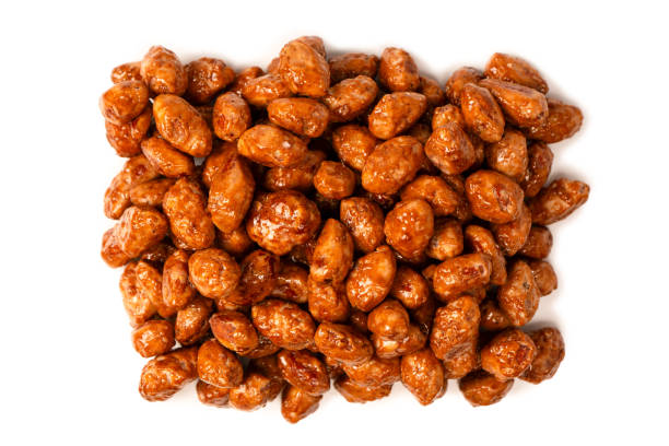 istock Tasty sweet roasted peanuts isolated on a white background. 2181931786
