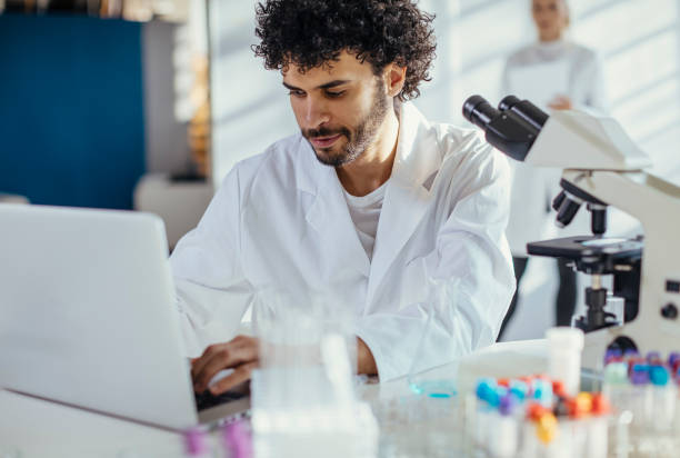 istock Focused Middle Eastern Scientist Working with Laptop in Laboratory 2181934469