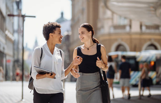 istock Diverse Female Students Using Technology on Urban Street 2181934706