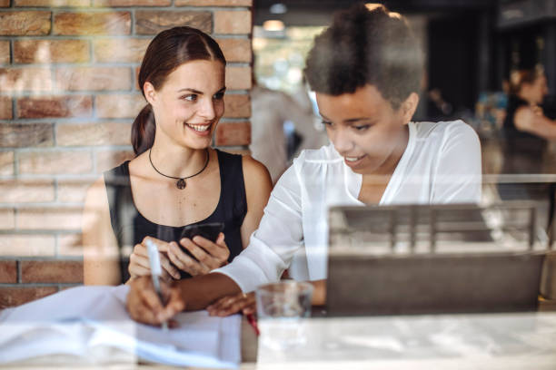 istock Diverse Female Students Sharing Time at Cafe 2181934734