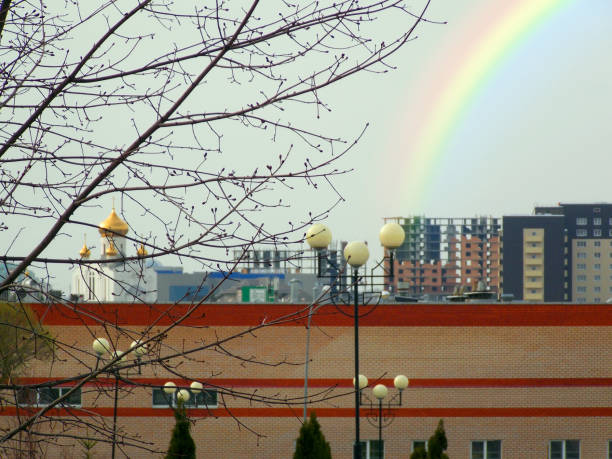 A rainbow appeared in the city well past 7pm on a rainy day.