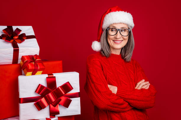 istock Photo of self-assured grandma crossed hands look pile gift wear specs hat pullover isolated red color background 2181937708