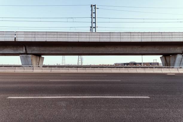 A long concrete overpass bridge with a road underneath