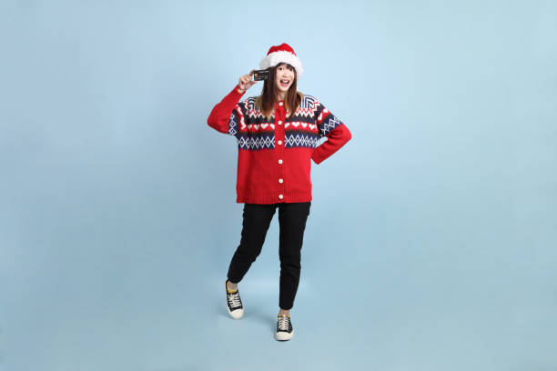 istock Woman wearing Santa hat 2181948069
