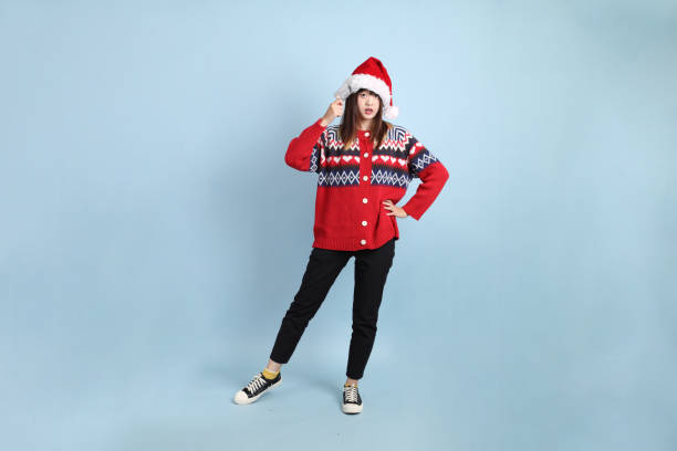 istock Woman wearing Santa hat 2181948072