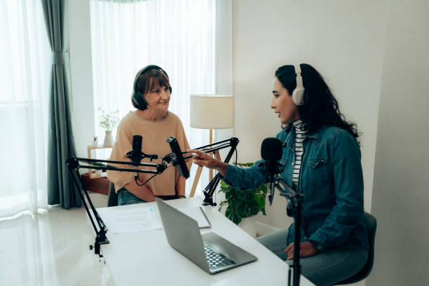 istock Mature Host and Guest in a Cozy Studio Space Engaged in Podcast Recording 2181950579