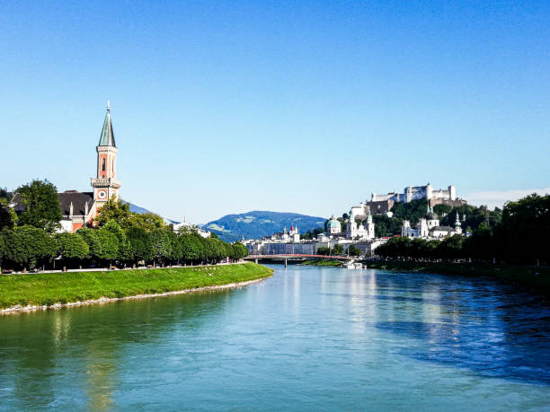 istock Blue river going through Austrian town against a blue sky 2181950622