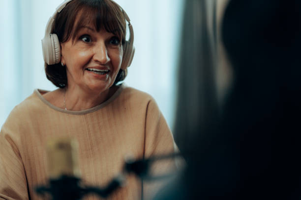 istock Professional Podcast Recording Session with Mature Host and Guest in Modern Home Studio 2181950641