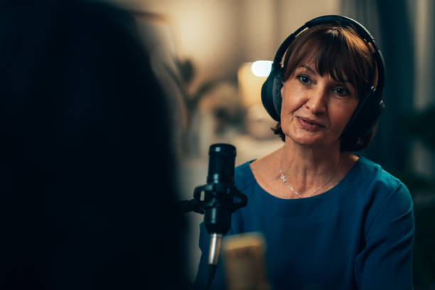 istock Experienced Female Podcaster Engaged in Dialogue with Guest in Studio 2181950645