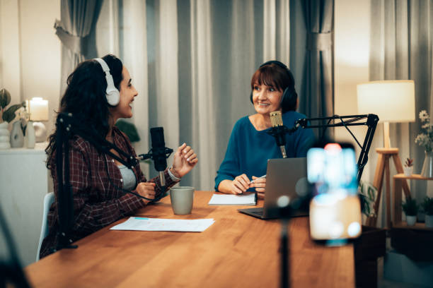 istock Female Podcasters in Studio: Senior Host and Young Guest Enjoying Podcast Dialogu 2181950721