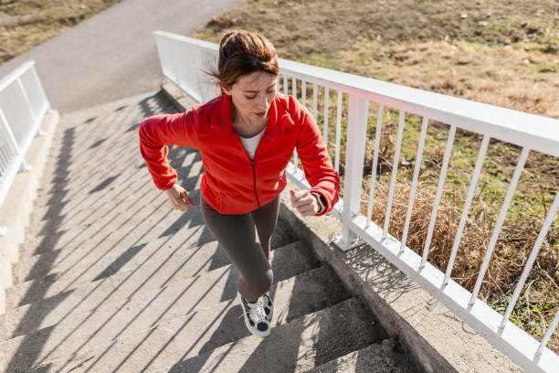 istock Energetic Woman Training by Climbing Stairs 2181950858
