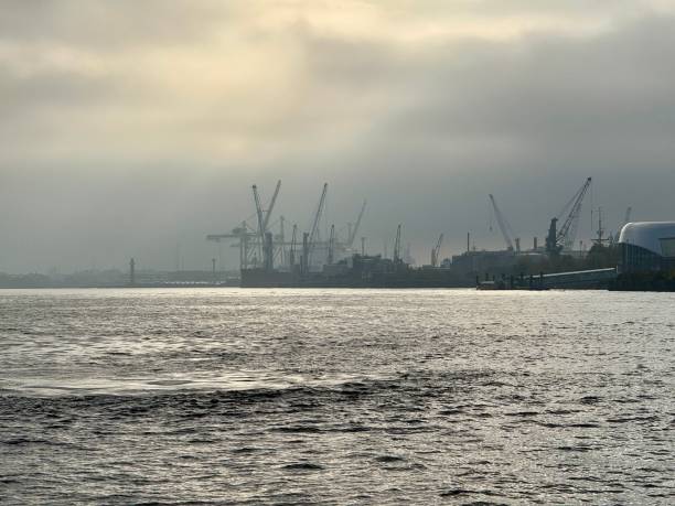istock Industrial harbor with cranes and cloudy sky. 2181952100
