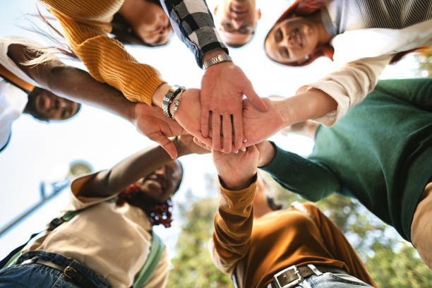 istock Students unite in a collaborative effort under the bright sky, sharing ideas and creating bonds during an outdoor university gathering 2181952132