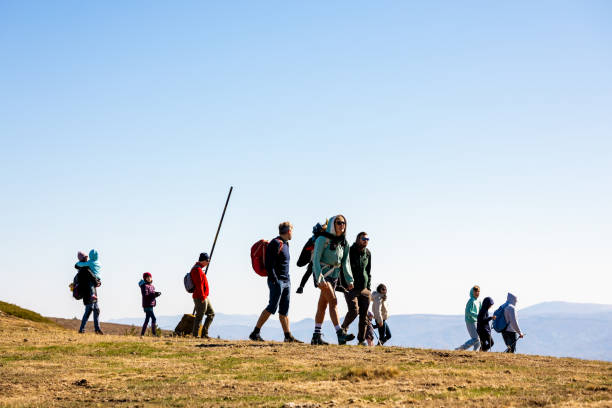 Families with small children having a mountain trip