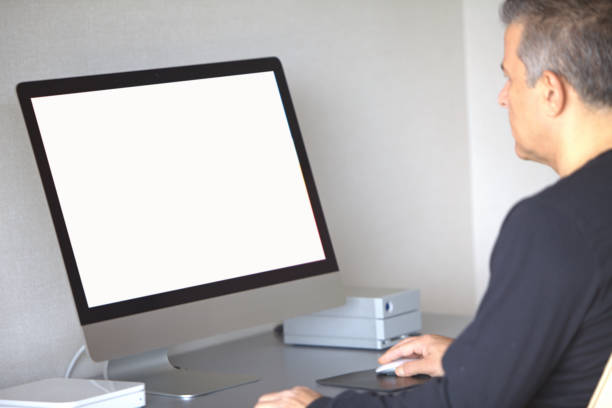 istock The photographer checking his photos on his computer at home, white screen. 2181957741