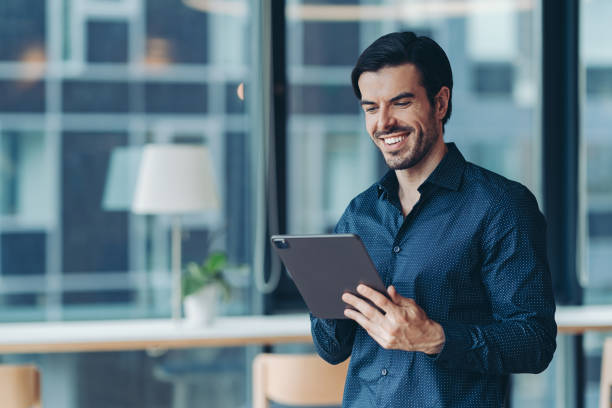 istock Businessman using digital tablet in the office 2181958169