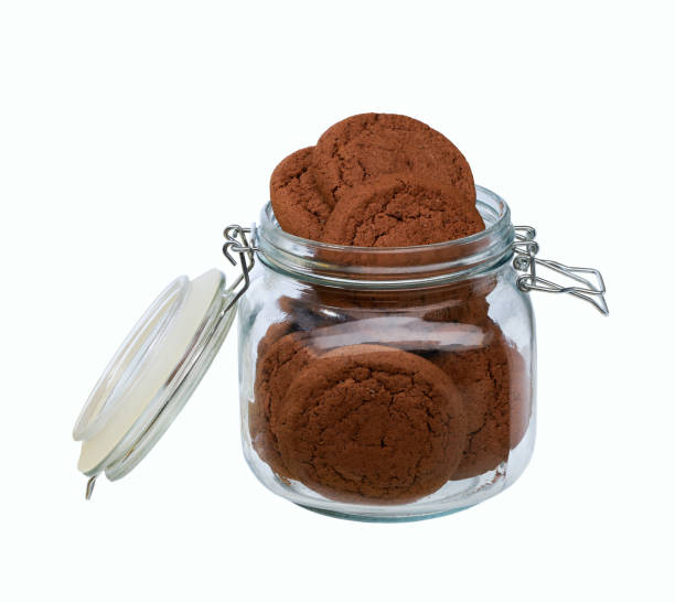 istock Open jar with chocolate cookies isolated on white background. 2181958375