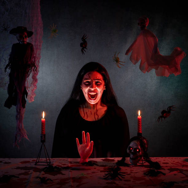istock Dramatic horror scene featuring a witch screaming as part of her ritual. 2181961375