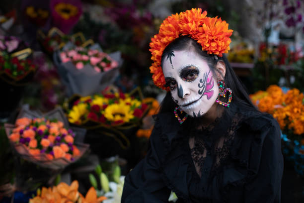 istock Mexican Catrina with Head Tilted, Surrounded by Flowers 2181962445
