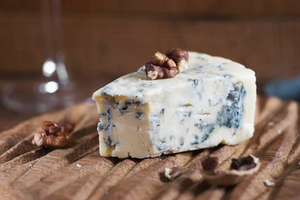 istock Blue cheese lies on a wooden board 2181965744