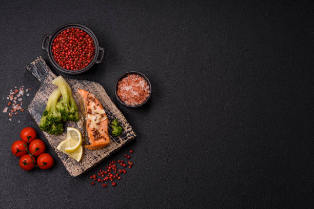 istock Grilled salmon with salt and spices, broccoli, tomatoes, rice 2181966872