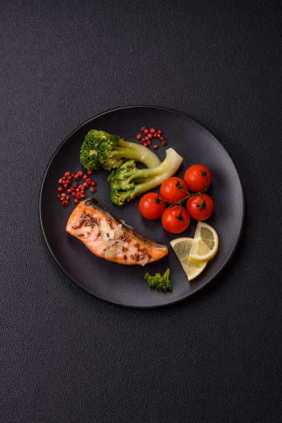 istock Grilled salmon with salt and spices, broccoli, tomatoes, rice 2181966882