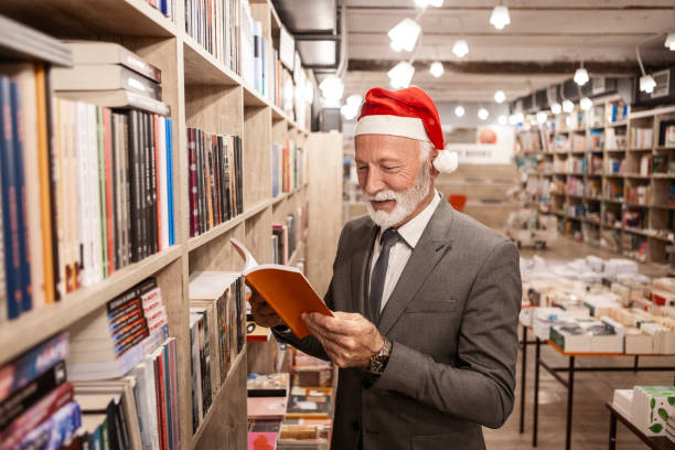 Senior Reader with a Santa Hat Exploring Literary Treasures This Christmas