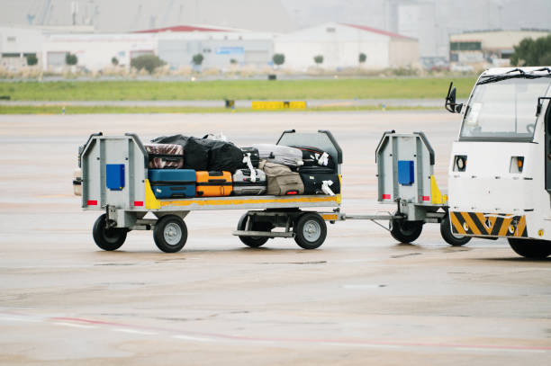 istock Airport cargo trailer with suitcases 2181969300