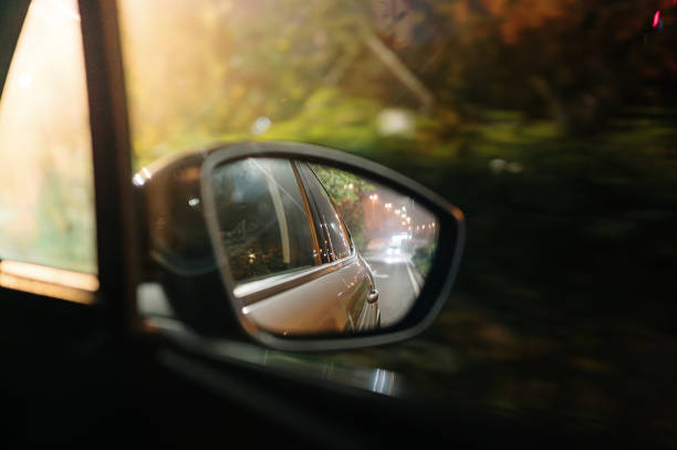 istock View from side view mirror of a car 2181969671