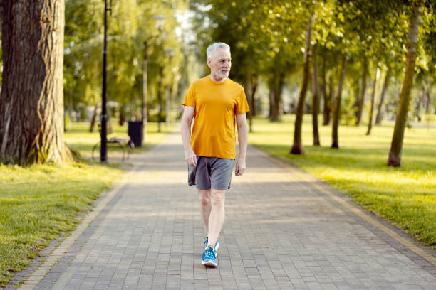 istock Senior man walking in park enjoying healthy lifestyle 2181971449