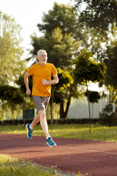 istock Senior man running in a park maintaining healthy lifestyle 2181971490