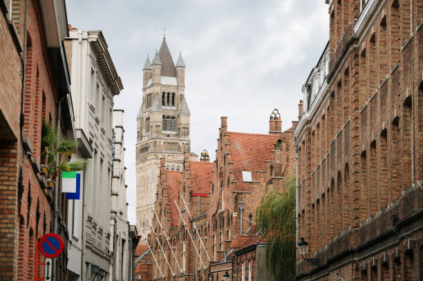 A street in Bruges, Belgium, with its cathedral in the background