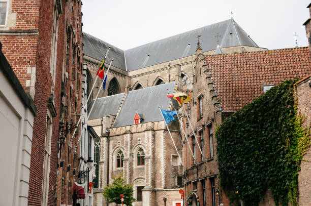 A street in Bruges, Belgium, with its cathedral in the background