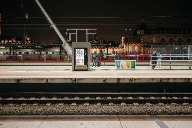 Railroad station platform at night with a vending machine