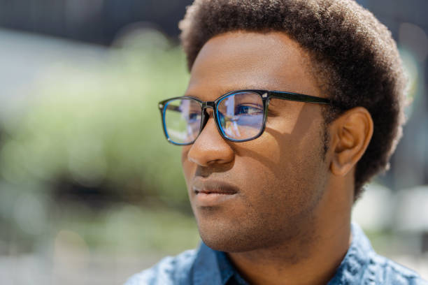 istock Young man wearing glasses looking away and thinking 2181975217