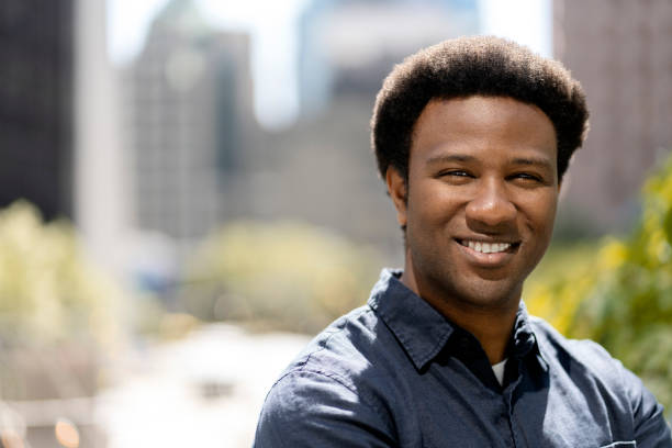 istock Young professional smiling in city park during daytime 2181975218