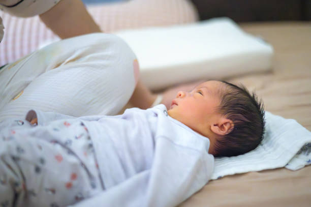 istock Newborn looks up with peaceful expression, relaxed. 2181977048