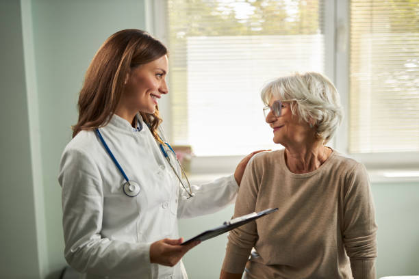 istock Female doctor talking with senior patient 2181979422