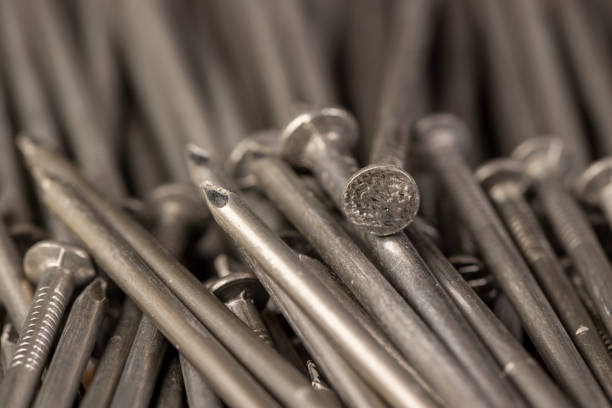 steel nails for construction work, nails made of steel for working with wooden objects, close up