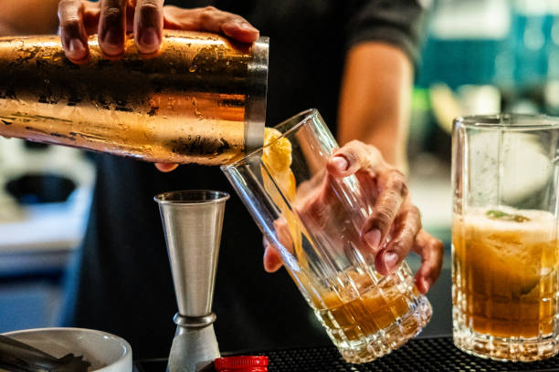 istock Close-up of a bartender preparing a drink on a pub 2181982591
