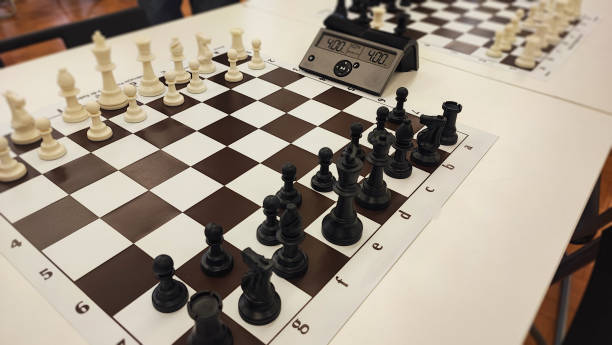 istock An empty hall with tables on which chess boards and timers are prepared. Concept of competition sport chess, leadership skills, self-development. 2181982888