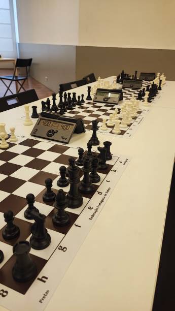 istock An empty hall with tables on which chess boards and timers are prepared. Concept of competition sport chess, leadership skills, self-development. 2181982890