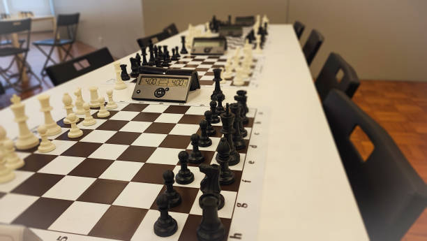 istock An empty hall with tables on which chess boards and timers are prepared. Concept of competition sport chess, leadership skills, self-development. 2181982941