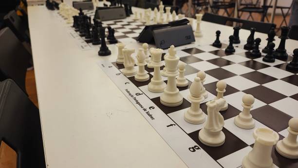 istock An empty hall with tables on which chess boards and timers are prepared. Concept of competition sport chess, leadership skills, self-development. 2181982943