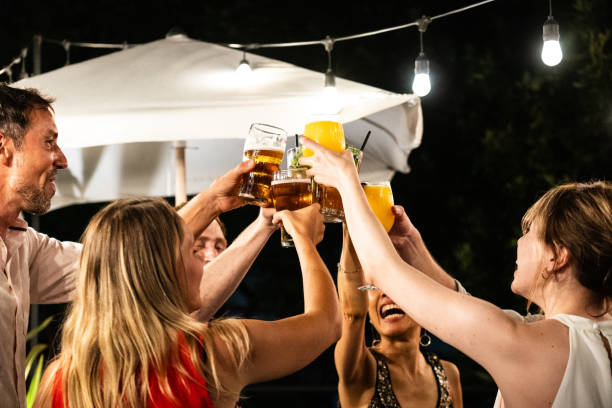 istock Friends a having fun toasting outdoors 2181984131