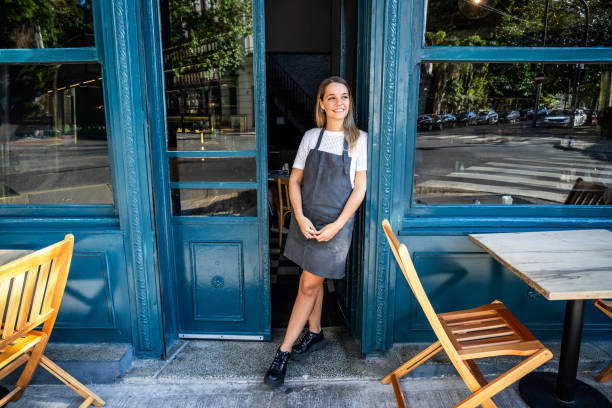 istock Waitress looking around on a cafeteria entrance 2181984831
