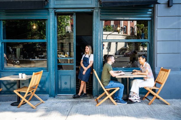 Friends talking on a sidewalk cafe