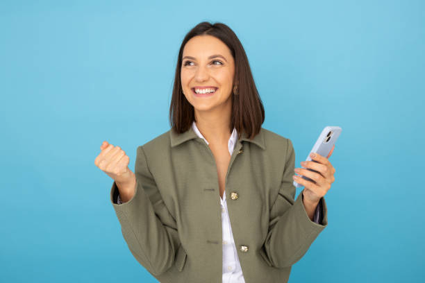 istock Confident woman with smartphone for digital tasks 2181985381