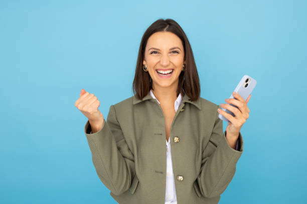 istock Confident woman with smartphone for digital tasks 2181985383